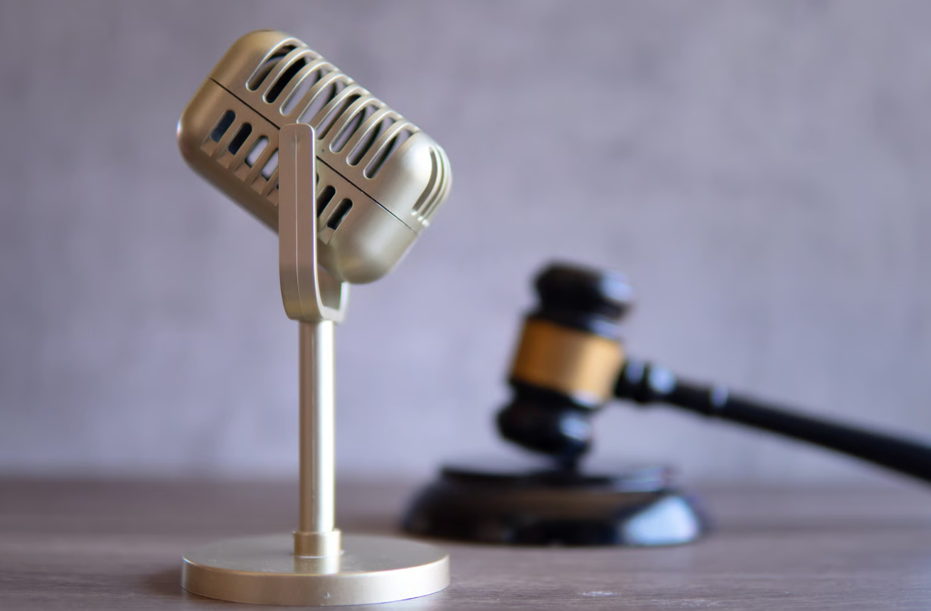 Vintage microphone beside a gavel — voice dictation for attorneys