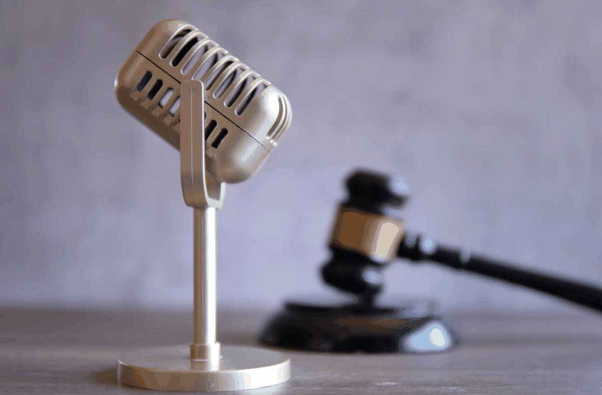 Vintage microphone beside a gavel — voice dictation for attorneys