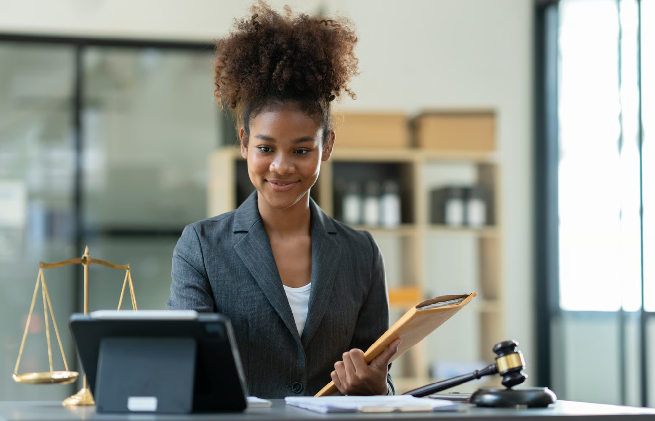 Attorney at her desk capturing client details — build case files by voice