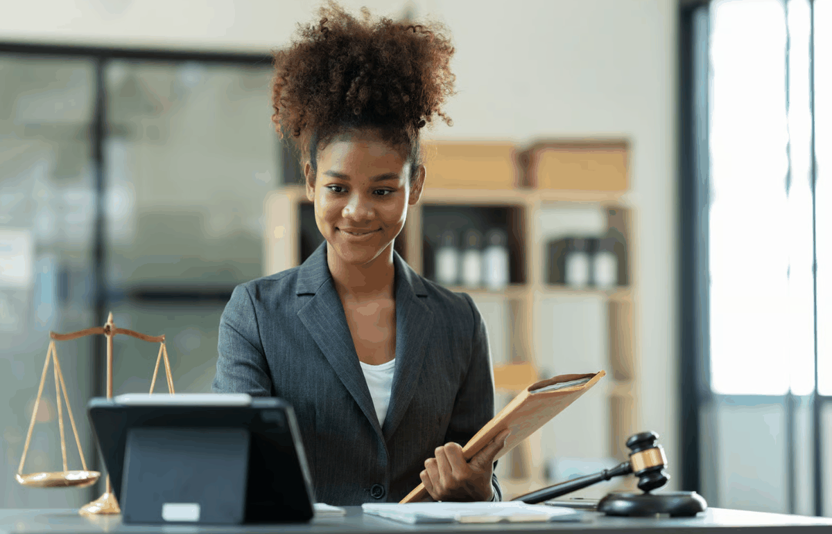 Attorney at her desk capturing client details — build case files by voice